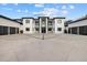 Modern home with black trim, multi-car garages, and a geometric driveway at 20307 74Th E Ave, Bradenton, FL 34202
