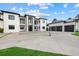 Modern home with black trim, multi-car garages, and a geometric driveway at 20307 74Th E Ave, Bradenton, FL 34202