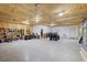 Large garage interior with ply wood walls, concrete floor, and multiple storage areas at 20307 74Th E Ave, Bradenton, FL 34202