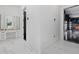 Hallway showcasing luxury finishes leading to vanity and garage at 20307 74Th E Ave, Bradenton, FL 34202