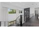 Bright hallway features a black marble fireplace and large windows with white curtains at 20307 74Th E Ave, Bradenton, FL 34202