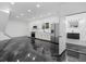 Modern kitchen with white cabinets, stainless appliances, and unique flooring at 20307 74Th E Ave, Bradenton, FL 34202
