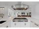 Modern kitchen features a gas range, a large island with marble countertops, and stainless steel appliances at 20307 74Th E Ave, Bradenton, FL 34202