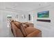 Spacious living room featuring a modern fireplace and large windows at 20307 74Th E Ave, Bradenton, FL 34202