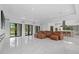 Open-concept living room with high ceilings, marble floors, and large windows at 20307 74Th E Ave, Bradenton, FL 34202