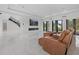 Bright living room with modern fireplace, staircase and views of the backyard at 20307 74Th E Ave, Bradenton, FL 34202