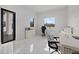 Modern office with sleek white furniture, tile flooring, and ample natural light at 20307 74Th E Ave, Bradenton, FL 34202