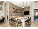 Charming bar area featuring brick accents, stylish lighting, and comfortable seating at 227 Maraviya Blvd, Nokomis, FL 34275