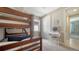 Bedroom with carpet, bunk bed, vanity, and access to the bathroom at 227 Maraviya Blvd, Nokomis, FL 34275