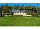 Community entrance sign set amidst lush greenery and a manicured lawn at 227 Maraviya Blvd, Nokomis, FL 34275