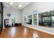 Spacious exercise room with hardwood floors, mirrors, and fitness equipment at 227 Maraviya Blvd, Nokomis, FL 34275