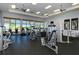 Well-equipped gym with modern machines and large windows offering picturesque waterfront views at 227 Maraviya Blvd, Nokomis, FL 34275