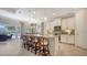 Bright kitchen with a large island, granite countertops, and stainless steel appliances at 227 Maraviya Blvd, Nokomis, FL 34275