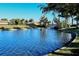 Scenic lake view with a charming bridge and a small boat, highlighting the community's water features at 227 Maraviya Blvd, Nokomis, FL 34275