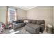 Cozy living room with an L-shaped couch, neutral-colored walls, and ample natural light at 227 Maraviya Blvd, Nokomis, FL 34275