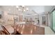 Open-concept kitchen and dining area leading to a comfortable living room at 227 Maraviya Blvd, Nokomis, FL 34275