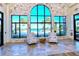 Elegant lobby seating area with natural light and scenic water views through expansive windows at 227 Maraviya Blvd, Nokomis, FL 34275