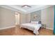 Spacious main bedroom features tray ceiling, en-suite bathroom access, and modern accent wall at 227 Maraviya Blvd, Nokomis, FL 34275