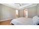 Bright bedroom with en-suite bath, wood flooring, and large doorway that lets natural light filter in at 227 Maraviya Blvd, Nokomis, FL 34275