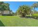Well maintained community landscaping with mature palms and picnic seating at 2640 Clubhouse Dr # 204, Sarasota, FL 34232