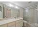Bathroom with shower and large mirror at 2640 Clubhouse Dr # 204, Sarasota, FL 34232