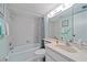 Clean bathroom showcasing a bathtub, shower, and sink with a large mirror at 2640 Clubhouse Dr # 204, Sarasota, FL 34232