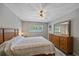 Comfortable bedroom with ceiling fan, natural light, and ample closet space at 2640 Clubhouse Dr # 204, Sarasota, FL 34232