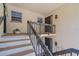 Inviting entryway with stairs leading to the unit's front door, plus decorative lighting and neutral decor at 2640 Clubhouse Dr # 204, Sarasota, FL 34232