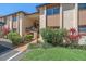 Charming condo exterior featuring lush landscaping, a well-maintained facade, and inviting entryway at 2640 Clubhouse Dr # 204, Sarasota, FL 34232