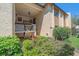 The front exterior of the building is surrounded by lush landscaping, creating a warm and inviting atmosphere at 2640 Clubhouse Dr # 204, Sarasota, FL 34232