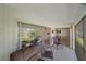 Spacious lanai with sliding glass doors opening to the interior, providing ample natural light at 2640 Clubhouse Dr # 204, Sarasota, FL 34232