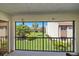 Relax on the screened patio with a beautiful view of the lush green lawn and landscaped community at 2640 Clubhouse Dr # 204, Sarasota, FL 34232