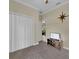 Bedroom featuring a double door closet, television, and natural light at 27207 Treadmill Dr, Punta Gorda, FL 33955