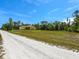 This property features a long driveway and plenty of green space at 27207 Treadmill Dr, Punta Gorda, FL 33955