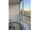 Relaxing balcony seating area with scenic views and a drying rack for convenience at 2755 Coconut Bay Ln # 1313 3M, Sarasota, FL 34237
