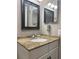 The bathroom vanity features granite countertops and a large mirror at 2755 Coconut Bay Ln # 1313 3M, Sarasota, FL 34237