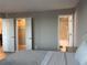 Bedroom featuring an ensuite bathroom and closet, offering both convenience and privacy at 2755 Coconut Bay Ln # 1313 3M, Sarasota, FL 34237