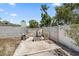 Backyard featuring concrete pad and cinderblock fire pit at 3041 Teal Ave, Sarasota, FL 34232