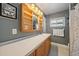 Updated bathroom featuring a framed mirror, vanity with drawers, and a linen closet at 3041 Teal Ave, Sarasota, FL 34232