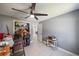 Bedroom featuring a fan and fixtures, light tile flooring, neutral paint, and a walk in closet at 3041 Teal Ave, Sarasota, FL 34232