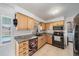 Bright kitchen features granite countertops, stainless steel appliances, and tiled flooring at 3041 Teal Ave, Sarasota, FL 34232