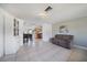 Bright living area features tile flooring, neutral color palette, and a cozy seating arrangement at 3041 Teal Ave, Sarasota, FL 34232