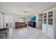 Spacious living room with tile flooring, neutral paint, and ample seating arrangements at 3041 Teal Ave, Sarasota, FL 34232
