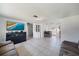 This living area features a large TV, tile flooring, and lots of space to relax and entertain at 3041 Teal Ave, Sarasota, FL 34232