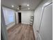 Comfortable bedroom with neutral walls, hardwood floors, and closet space at 3312 Bay Shore Rd, Sarasota, FL 34234