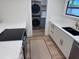 Updated kitchen featuring white cabinets, granite countertops, and stainless steel appliances at 3312 Bay Shore Rd, Sarasota, FL 34234