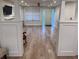 Spacious living room with hardwood floors, natural light, and open floor plan at 3312 Bay Shore Rd, Sarasota, FL 34234