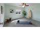 Bedroom with gray carpet and blue walls, and a mat, blocks and bench for exercise or yoga at 3607 Twin Rivers Trl, Parrish, FL 34219