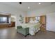 Inviting bedroom with ensuite bathroom, neutral walls and stylish furniture at 3607 Twin Rivers Trl, Parrish, FL 34219