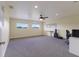 Spacious bonus room featuring carpet, neutral paint, and natural light at 3607 Twin Rivers Trl, Parrish, FL 34219